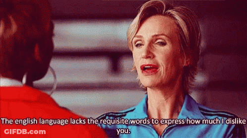 Woman In Blue Jacket Talking To Woman In Red Jacket GIF