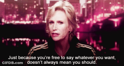 Woman In Blue Jacket Talking To Woman In Red Jacket GIF