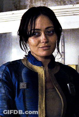 Woman In Blue Jacket With Vault Boy Badge GIF