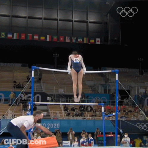 Woman In Blue Leotard Doing Parallel Bars GIF