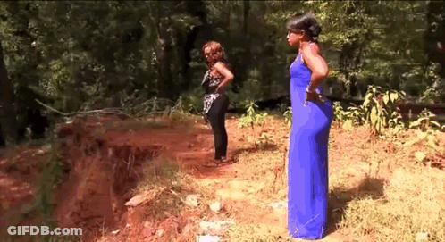 Woman In Blue Next To Woman In Black GIF