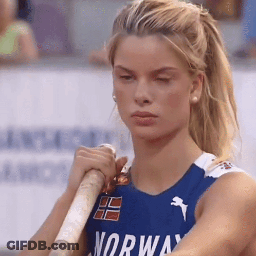 Woman In Blue Norway Shirt Holding Pole GIF