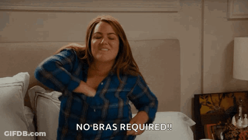 Woman In Blue Plaid Shirt Holding Breasts Saying No Bras Required GIF