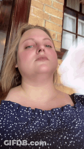 Woman In Blue Polka Dot Off Shoulder Top GIF