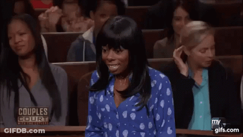 Woman In Blue Polka Dot Shirt In Courtroom GIF