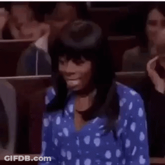 Woman In Blue Polka Dot Shirt Sitting Classroom GIF