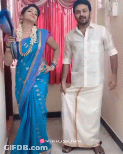 Woman In Blue Saree And Man In White Shirt Posing GIF