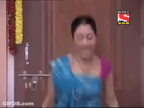Woman In Blue Saree Standing By Sony Logo GIF