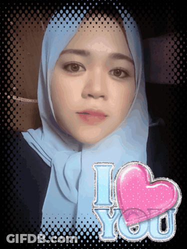 Woman In Blue Scarf With Pink Heart Saying I Love You GIF