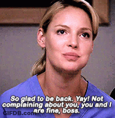Woman In Blue Scrub Saying So Glad To Be Back Yay Not Complaining About You You And I Are Fine Boss GIF