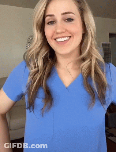 Woman In Blue Scrub Top Smiling GIF