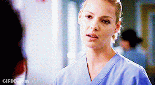 Woman In Blue Scrub Top Talking GIF