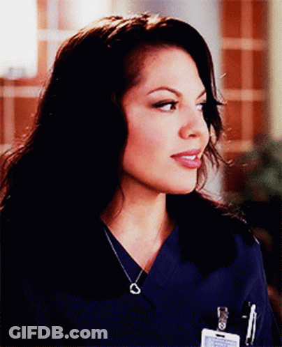 Woman In Blue Scrub Top With Name Tag On Pocket GIF