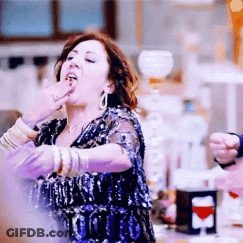Woman In Blue Sequin Dress Covering Mouth GIF
