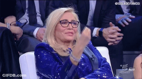 Woman In Blue Sequined Jacket Clapping GIF