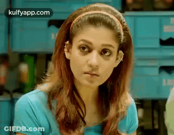 Woman In Blue Shirt And Headband GIF
