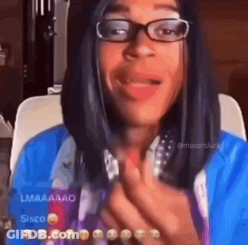 Woman In Blue Shirt And Pearls Holding Book And Pointing GIF