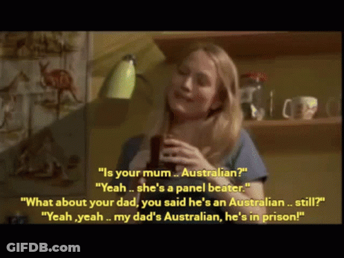 Woman In Blue Shirt Holding Cup Talking To Another Woman GIF
