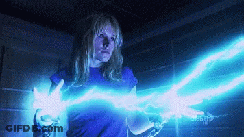 Woman In Blue Shirt Holding Lightning Bolt Next To Global HD Sign GIF