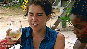 Woman In Blue Shirt Holding Wine Glass GIF