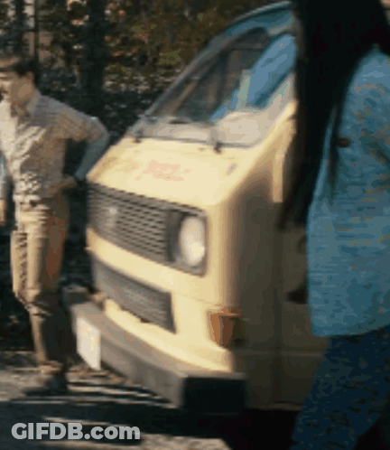 Woman In Blue Shirt In Front Of DHL Van GIF