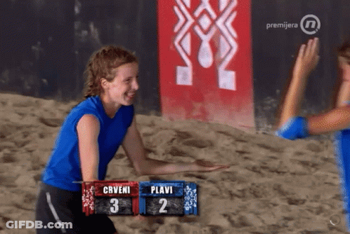 Woman In Blue Shirt In Front Of Prvijera Sign GIF