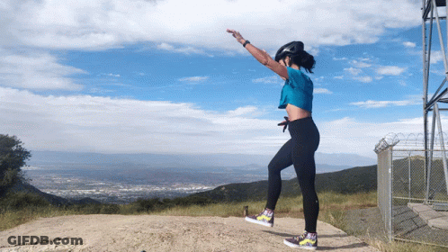 Woman In Blue Shirt Jumping GIF