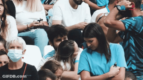 Woman In Blue Shirt Kissing Man GIF