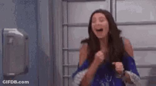 Woman In Blue Shirt Laughing At Hand Sanitizer Dispenser GIF
