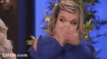 Woman In Blue Shirt Making Funny Face GIF