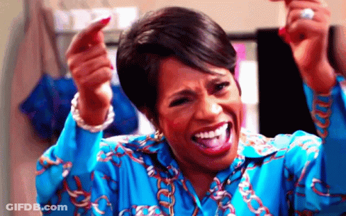 Woman In Blue Shirt Making Funny Face Pointing GIF