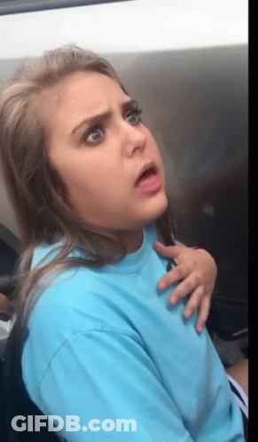 Woman In Blue Shirt Making Funny Face GIF