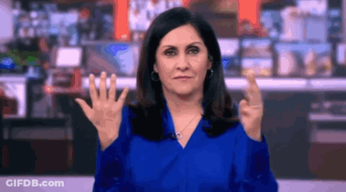 Woman In Blue Shirt Making Rude Gesture GIF