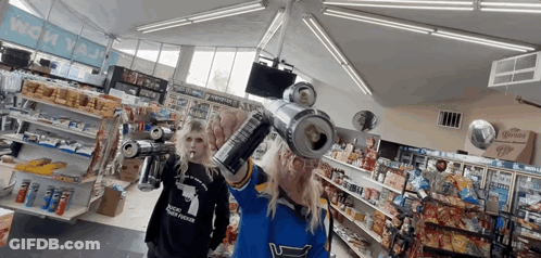 Woman In Blue Shirt No. 1 Holding Soda GIF