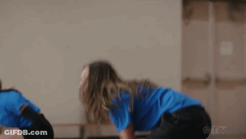 Woman In Blue Shirt Playing Volleyball With Others GIF