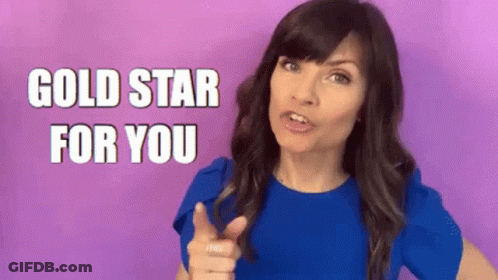 Woman In Blue Shirt Pointing Gold Star For You GIF