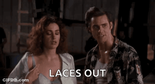 Woman In Blue Shirt Putting On Laces GIF