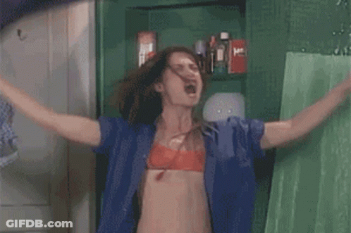Woman In Blue Shirt, Red Bra, Arms Outstretched GIF