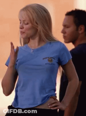 Woman In Blue Shirt Saying Athletics Next To Man GIF
