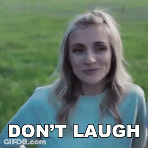 Woman In Blue Shirt Saying Don't Laugh GIF