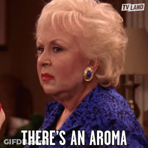 Woman In Blue Shirt Says Aroma GIF