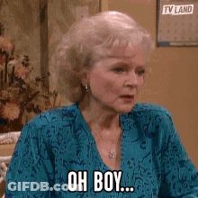 Woman In Blue Shirt Says Oh Boy GIF