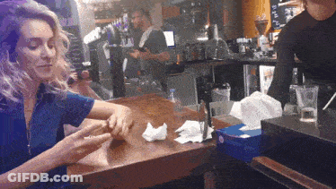 Woman In Blue Shirt Sitting At Restaurant GIF