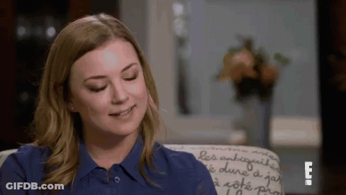 Woman In Blue Shirt Sitting Smiling Eyes Closed GIF