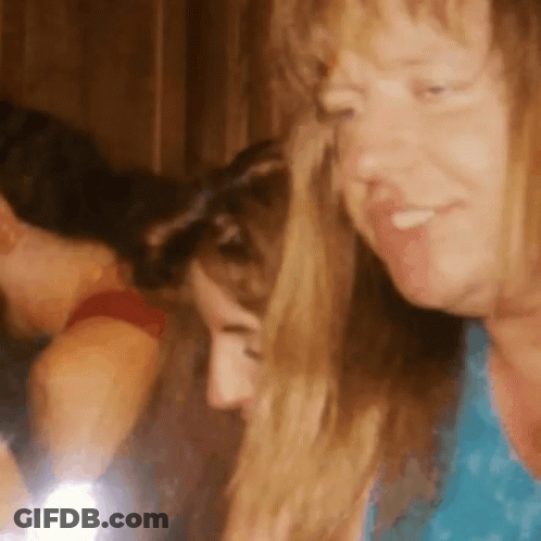 Woman In Blue Shirt Smiling At Another Woman GIF
