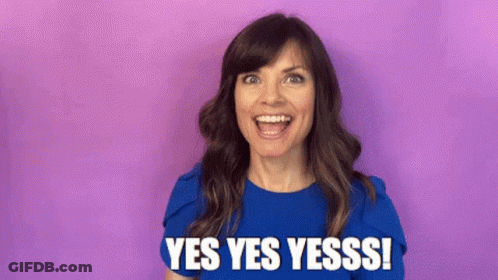 Woman In Blue Shirt Smiling Saying Yes Yes Yesss GIF