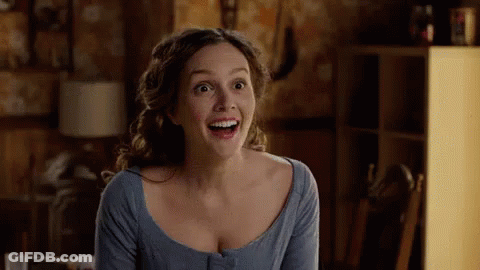 Woman In Blue Shirt Smiling With Mouth Open GIF