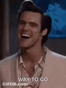 Woman In Blue Shirt Standing In Hallway Saying That's How It's Done GIF