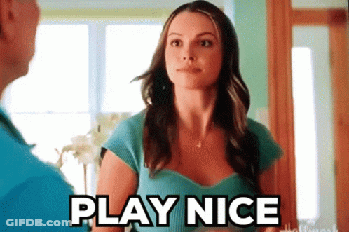 Woman In Blue Shirt Tells Man Play Nice GIF