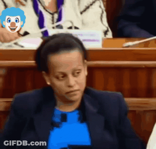 Woman In Blue Shirt With Clown Face On Head GIF